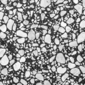Dark gray composite material with white marble chips, polished surface, irregular speckled pattern, varied fragment sizes, robust texture.